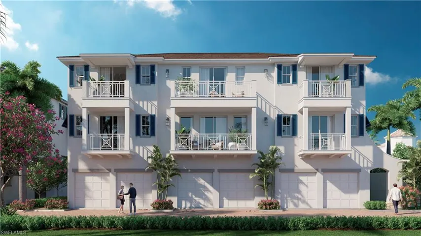 View of front facade with a balcony and a garage
