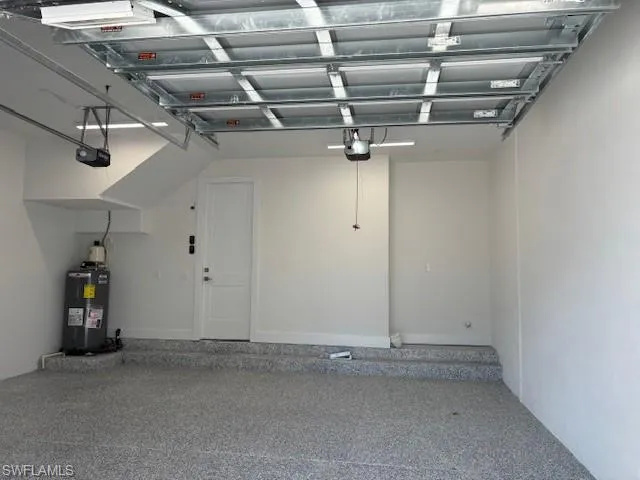 Garage with a garage door opener and water heater