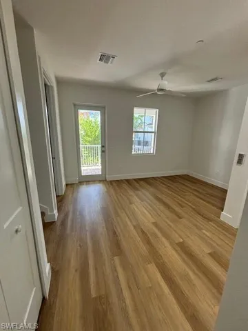 Unfurnished room featuring ceiling fan and light hardwood / wood-style floors