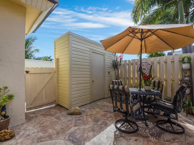 View of patio / terrace with outdoor dining area and a gate