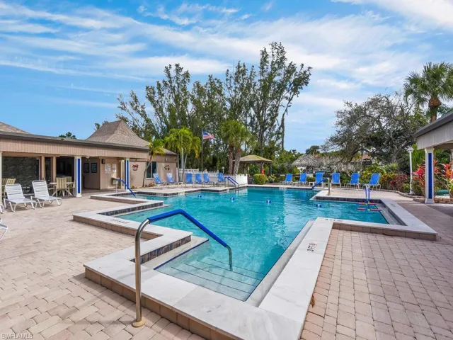 Community pool featuring a patio