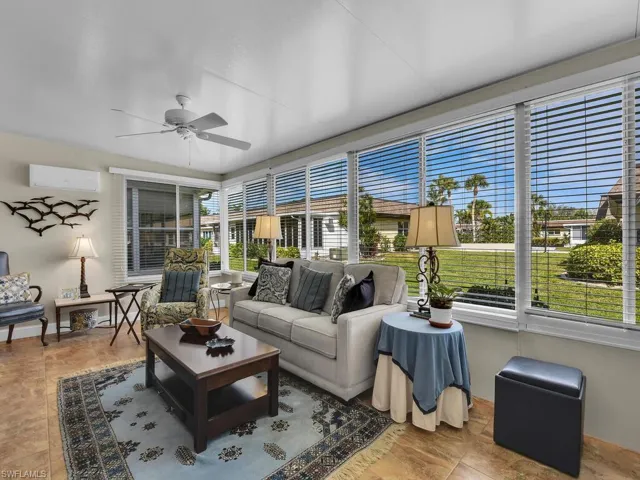 Sunroom / solarium featuring a wall mounted AC