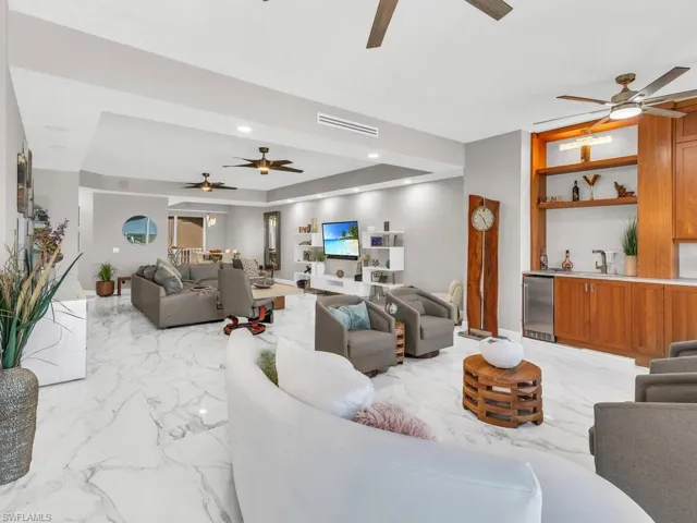 Living room featuring a raised ceiling