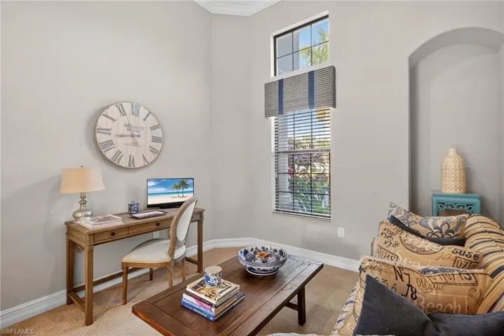 Home office featuring carpet flooring and ornamental molding