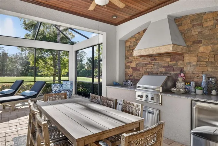 Sunroom / solarium featuring a sink