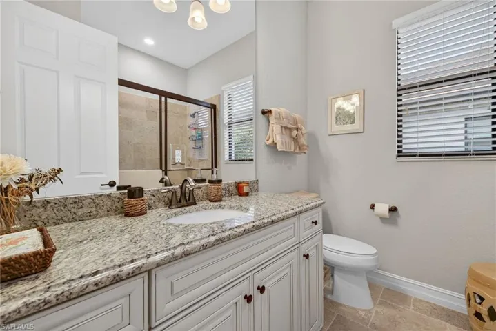 Bathroom with vanity and a shower stall