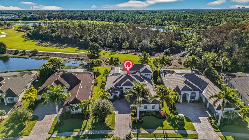 Aerial view of property's location featuring nearby suburban area