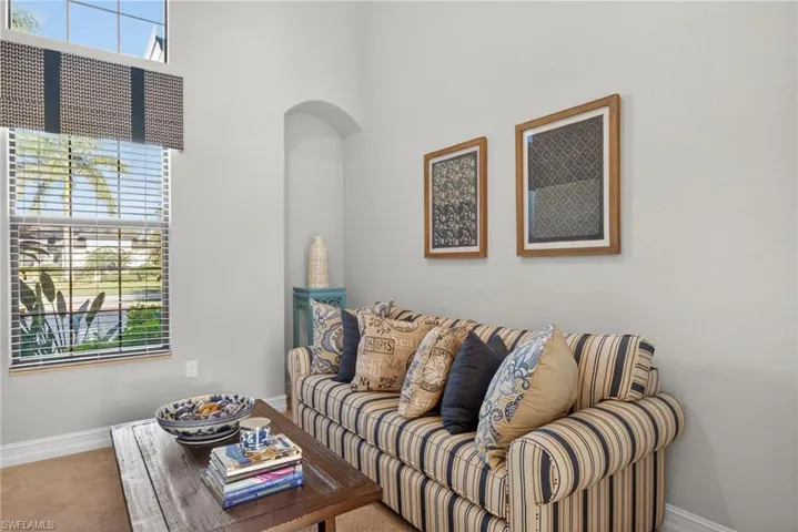 Living room featuring baseboards and carpet floors