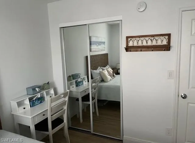 Bedroom featuring a closet and wood finished floors