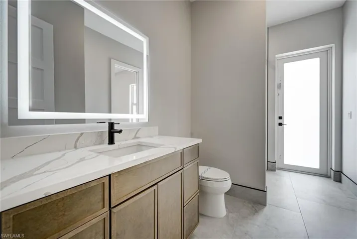 Bathroom 4 featuring vanity and toilet