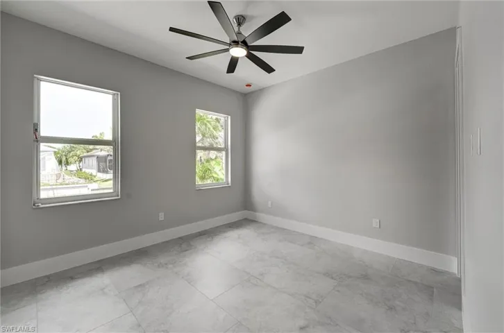 Bedroom 3 featuring baseboards and a ceiling fan