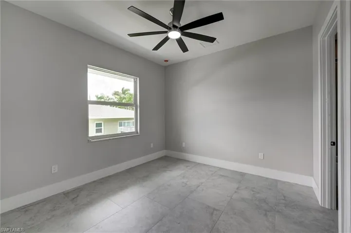 Bedroom 4 baseboards and a ceiling fan