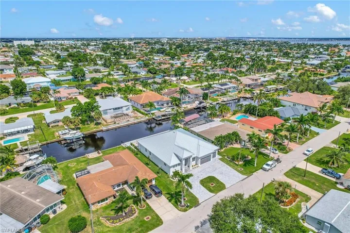 Aerial perspective of suburban area with a large body of water
