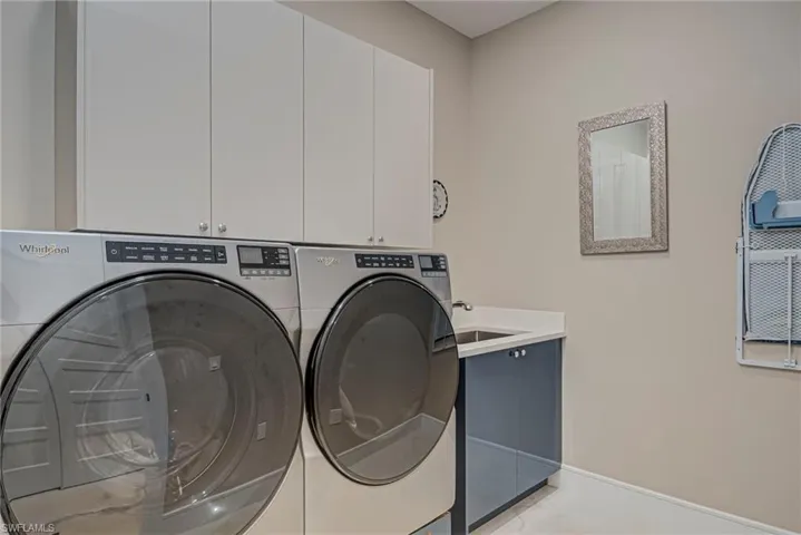 Laundry room with cabinet space and washer and dryer