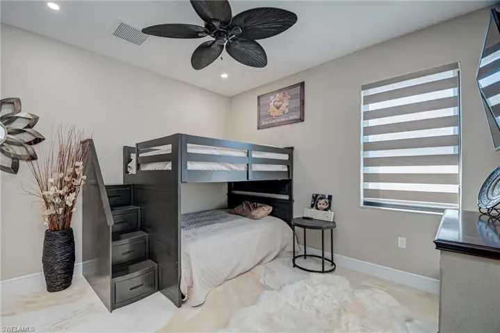 Bedroom featuring a ceiling fan and recessed lighting