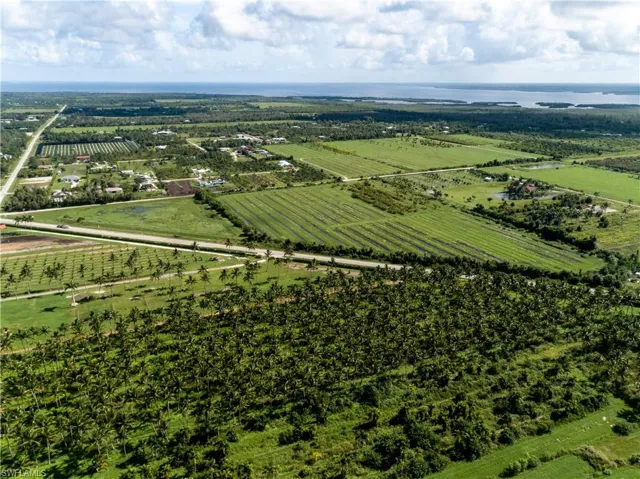 Birds eye view of property with a rural view