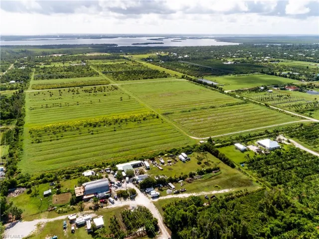 Birds eye view of property featuring a rural view