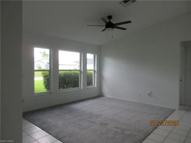 GREAT ROOM WITH HIGH CEILINGS, NEW CARPET AND CEILING FAN