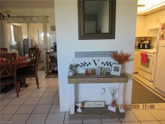 Dining area with light tile patterned floors