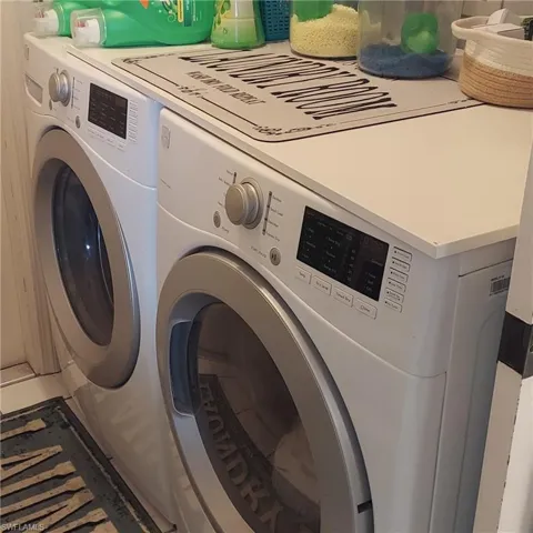 Washroom with washing machine and dryer