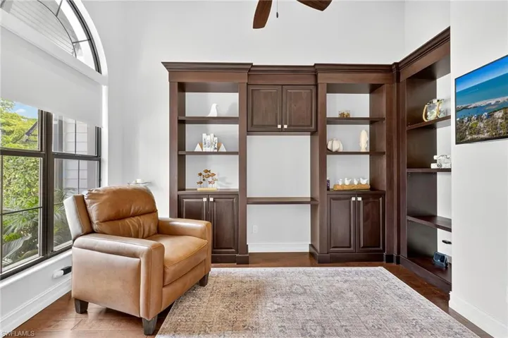 Sitting room featuring wood finished floors and ceiling fan
