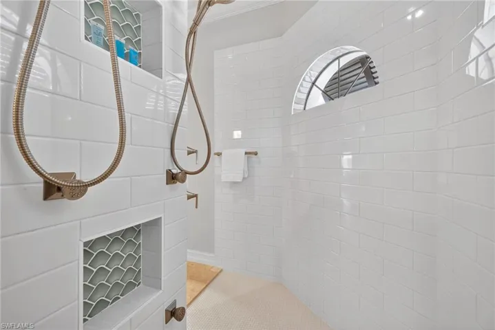 Full bathroom featuring tiled shower