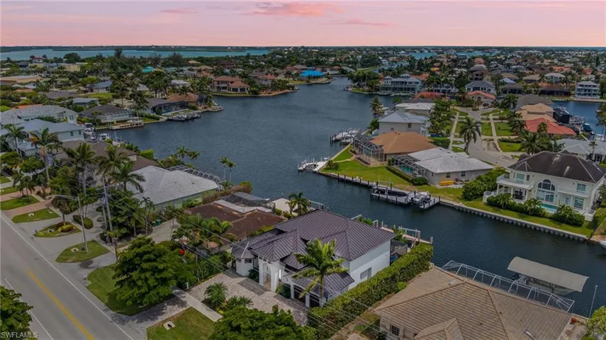 Aerial perspective of suburban area with a large body of water