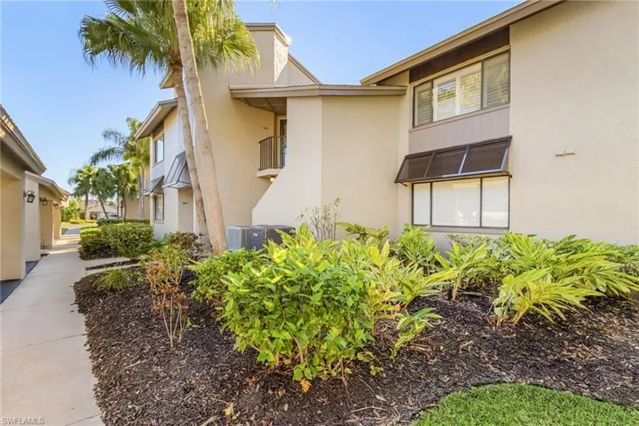 View of side of property which is nicely landscaped all the way around.