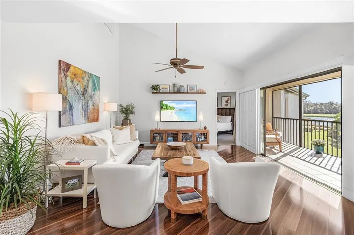 Light, bright and open great room with triple sliders out to the screened lanai.