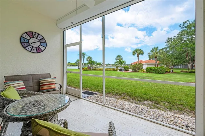 Sunroom / solarium with a water view