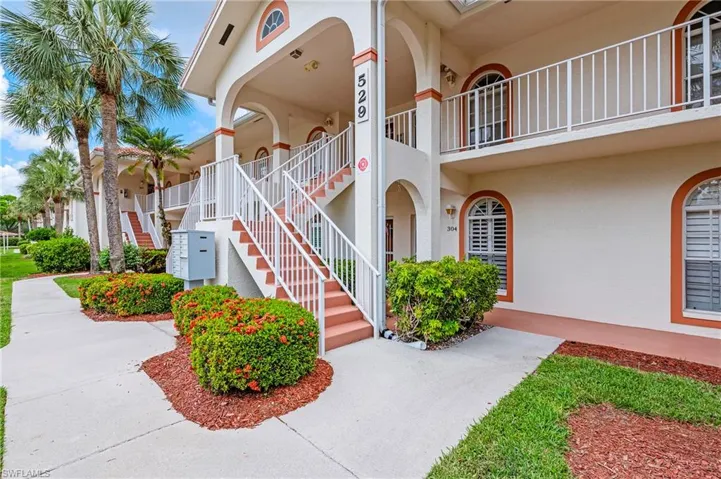 Property entrance featuring stucco siding