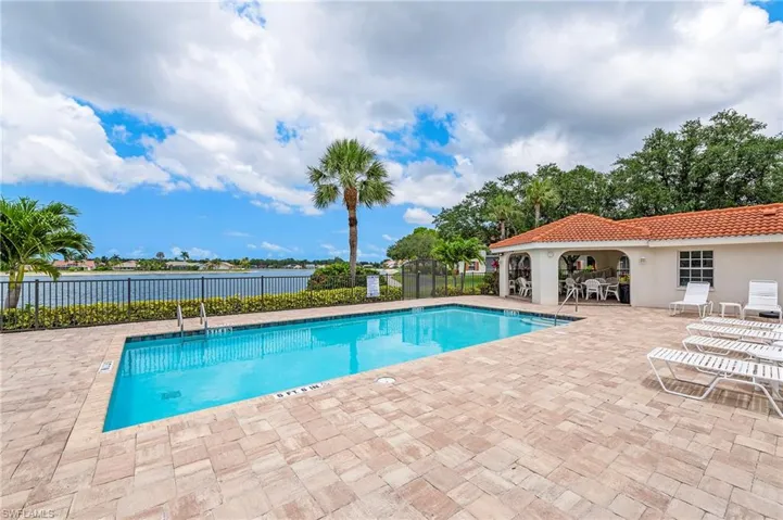 Community pool featuring a patio