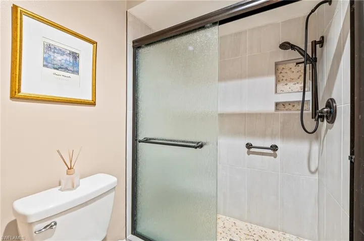 Full bath with a shower stall