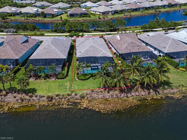 View of rear of home showing Antigua Way and the lake in the front of the home.