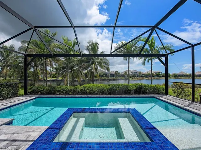 Screened Lanai with pool, spa and picture frame rear screen to enhance your view of wide lake-multi color pool and spa lighting.
