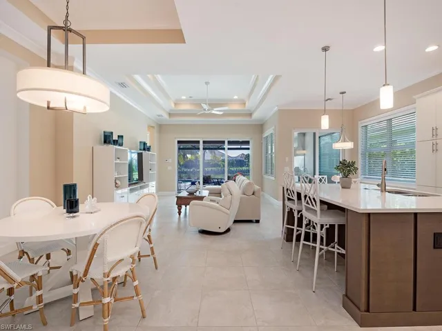 View of dining room, kitchen and living room from the entry hallway.
