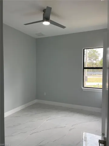 Spare room featuring ceiling fan