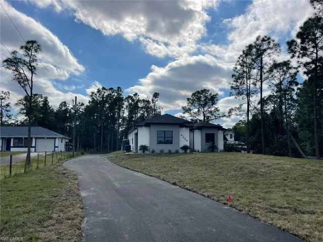 Single story home featuring a front yard