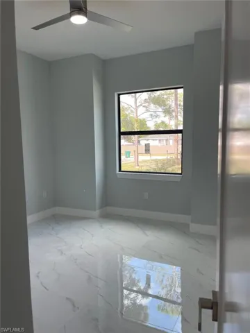 Unfurnished room with ceiling fan