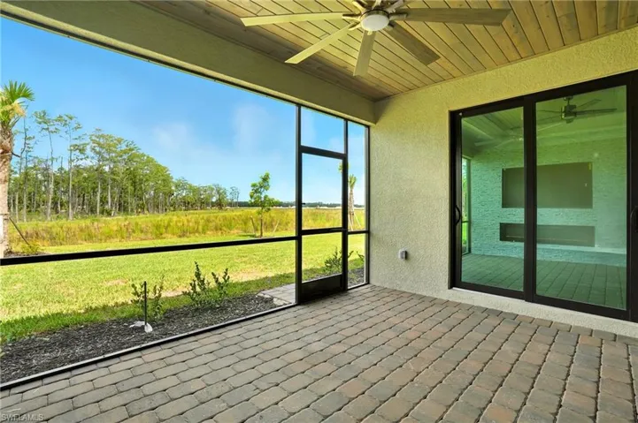 Unfurnished sunroom with a ceiling fan