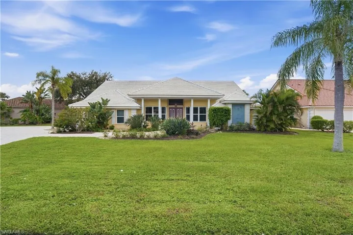 Front yard with plenty of green space.