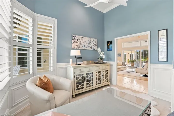 Volume ceilings enhance the den’s sense of space, currently providing an ideal setting for a comfortable and sophisticated home office.