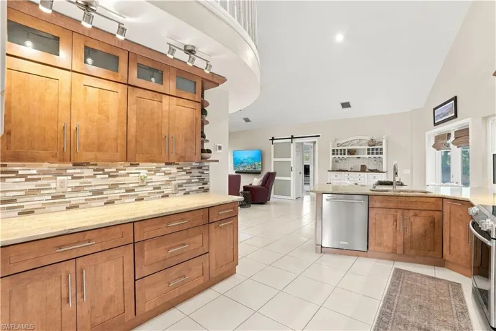 Plenty of counter space and cabinetry in this well-appointed kitchen.
