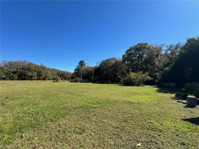 View of yard with a rural view