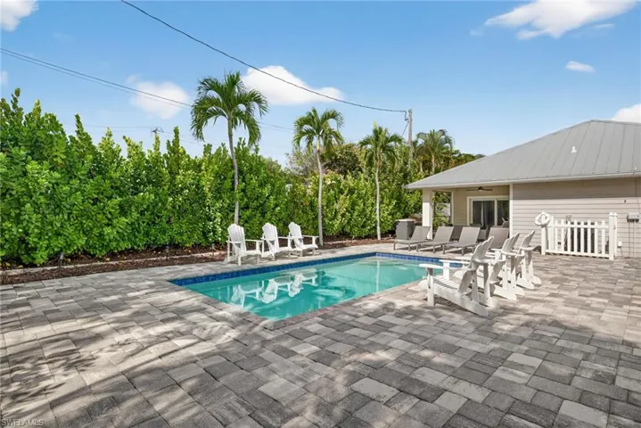 Swimming pool featuring a patio and ceiling fan