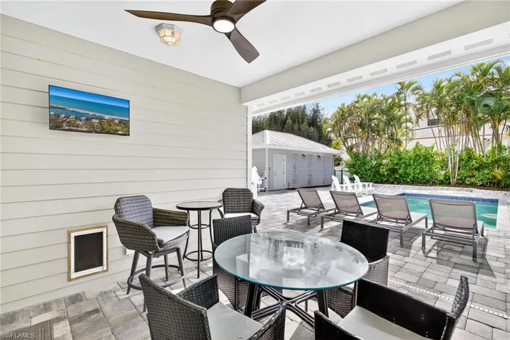 View of patio / terrace with outdoor dining area and a ceiling fan