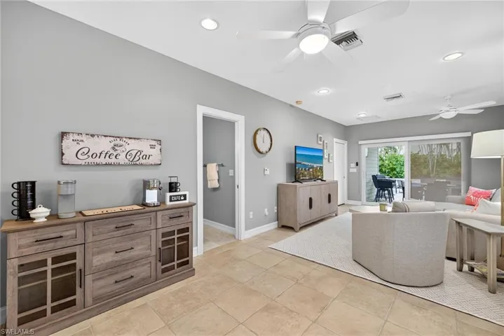 Living area with ceiling fan and recessed lighting