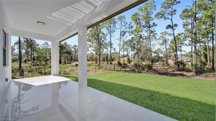 Fenced backyard with a patio