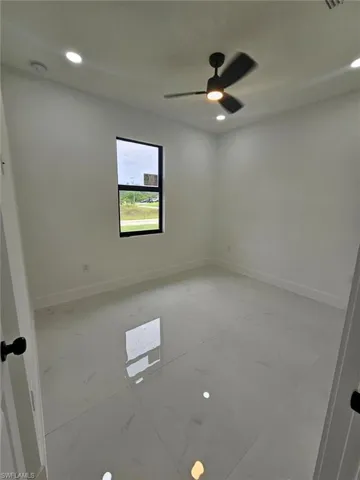 Empty room featuring recessed lighting and ceiling fan