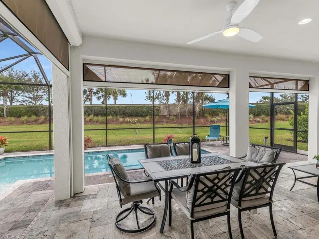 Storm Smart motorized shades to enclose the entire Lanai for outside living